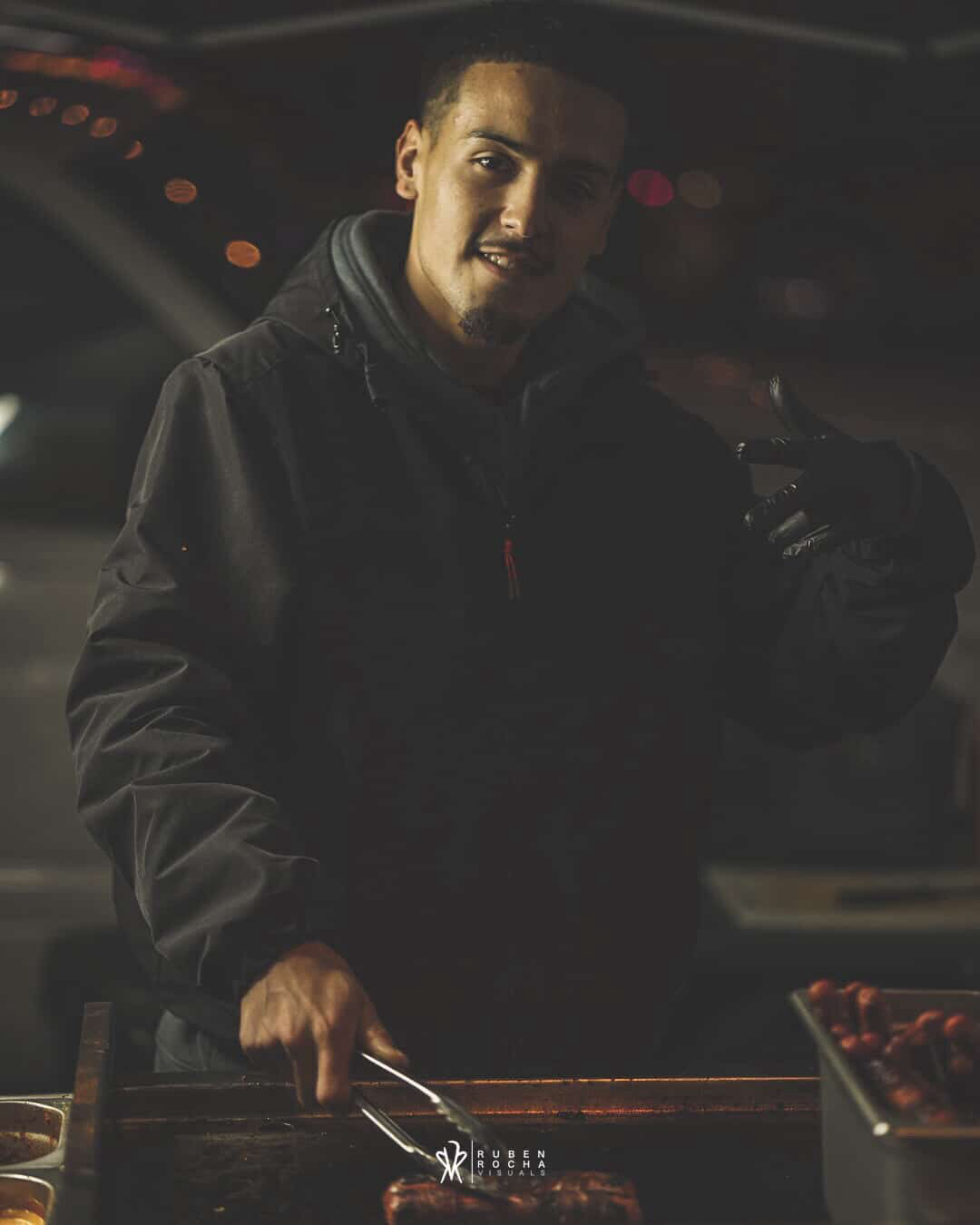 Tower Hotdogs owner working the grill